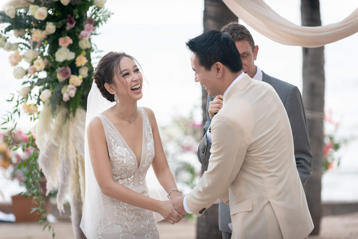 Panya and Wilson sharing a joyful moment during their wedding ceremony