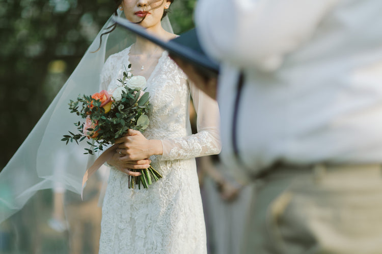 A bride holding her wedding bouquet